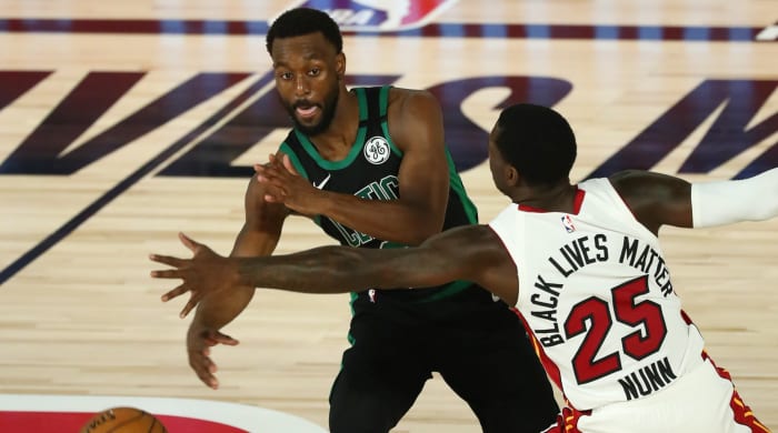 Boston Celtics guard Kemba Walker (8) passes the ball while Miami Heat guard Kendrick Nunn (25) defends during the second half in game one of the Eastern Conference Finals of the 2020 NBA Playoffs